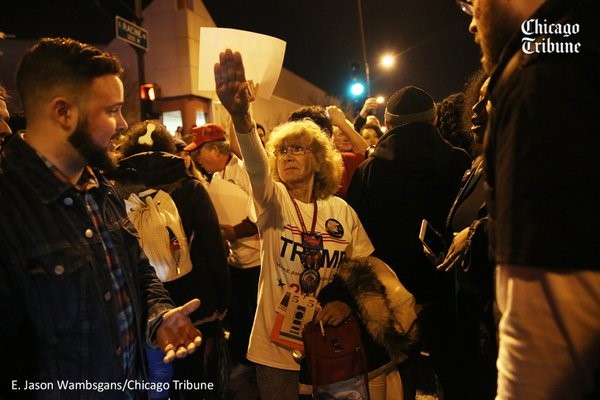 Donald Trump supporter Birgitt Peterson, center, of Yorkville, argues with protesters on March 11, 2016,outside the UIC Pavilion after the rally for the Republican presidential candidate was canceled. E. Jason Wambsgans / Chicago Tribune