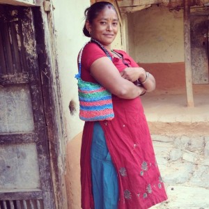 Woman in Nepal showing one of the bags made by Walden's social enterprise Trashé| Picture by Cara Walden