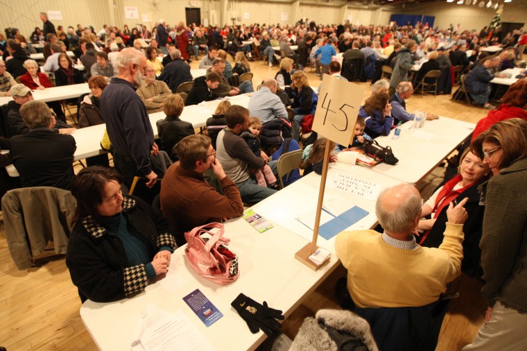 People gather inside the Dubuque County Fairground's ballroom Tuesday night during 2012 Iowa Presidential Caucus. Over a thousand filled the room of the republican site. Picture by Dave Kettering