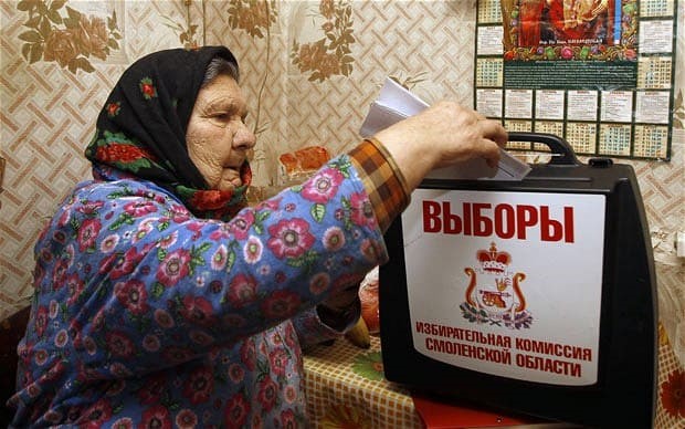 Yevdokia Knyazeva votes at her home in the village of Oster, 380 kilometers (237 miles) west of Moscow Photo: AP Photo/Sergei Grits via telegraph.co.uk