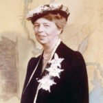 Photograph of Eleanor Roosevelt in a black dress with white accessories and white hat on yellow background.