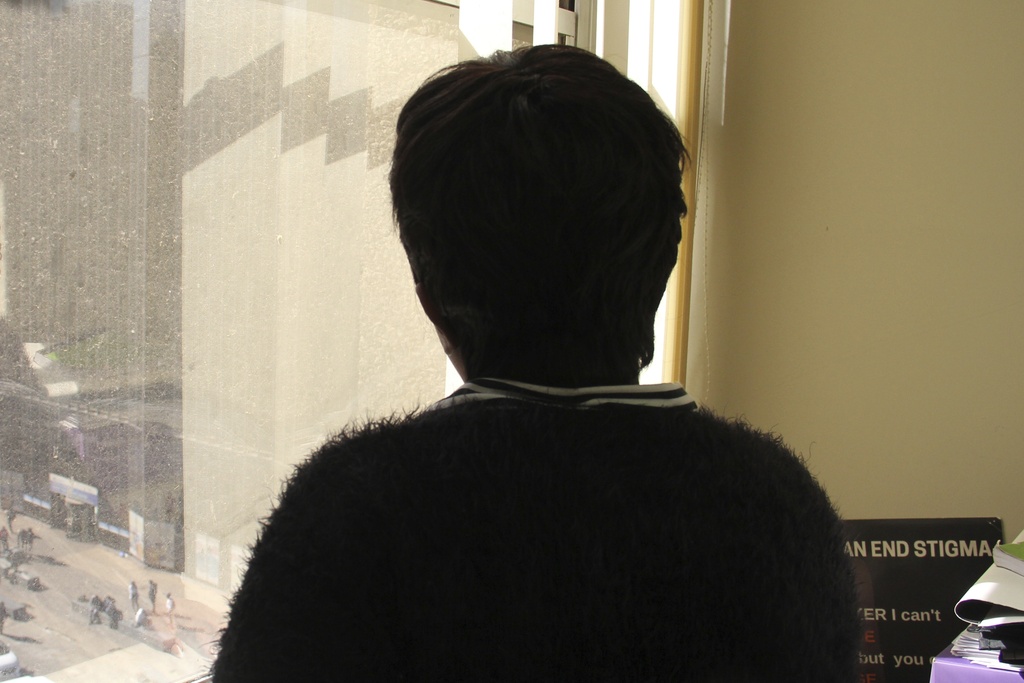 Woman looking out window